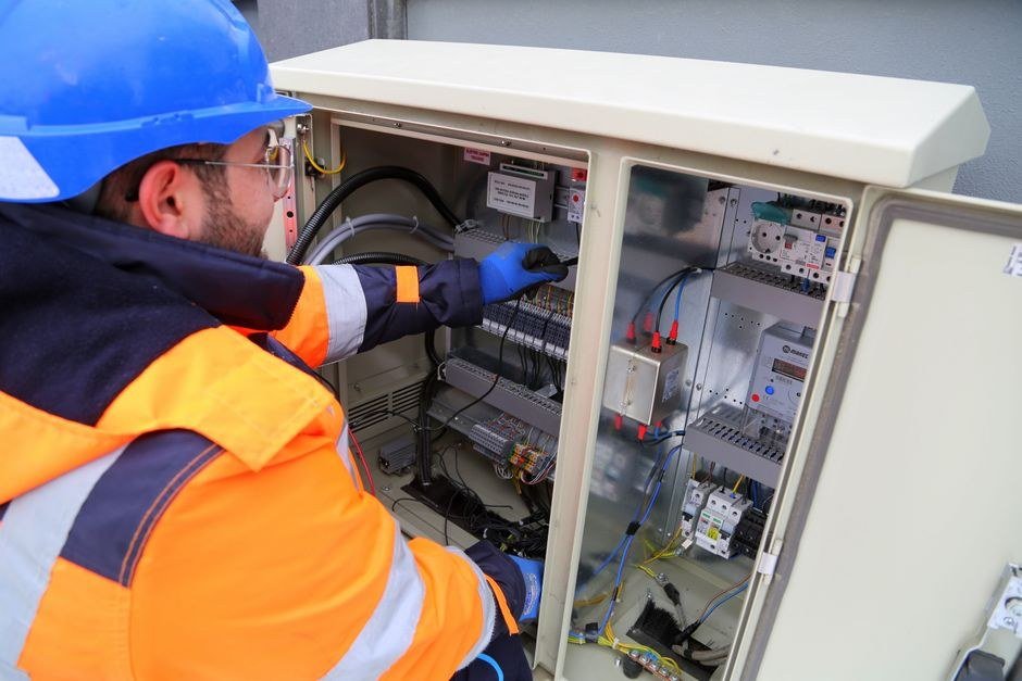 Electrician working on a distribution board panel